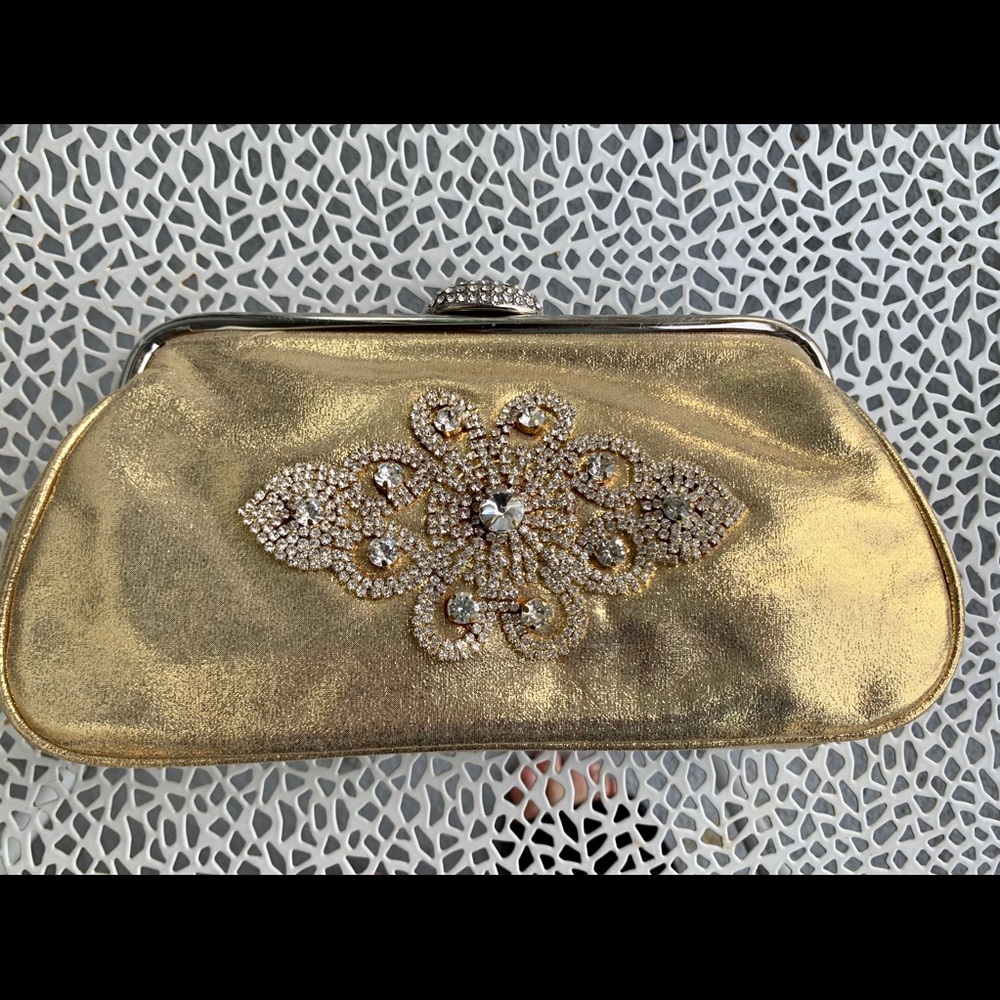 Small gold clutch with crystal embellish front